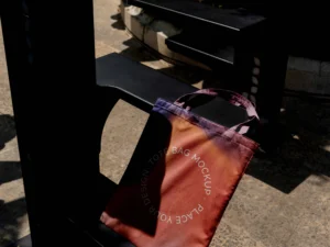 colorful tote bag mock up outdoors on golden hour 4