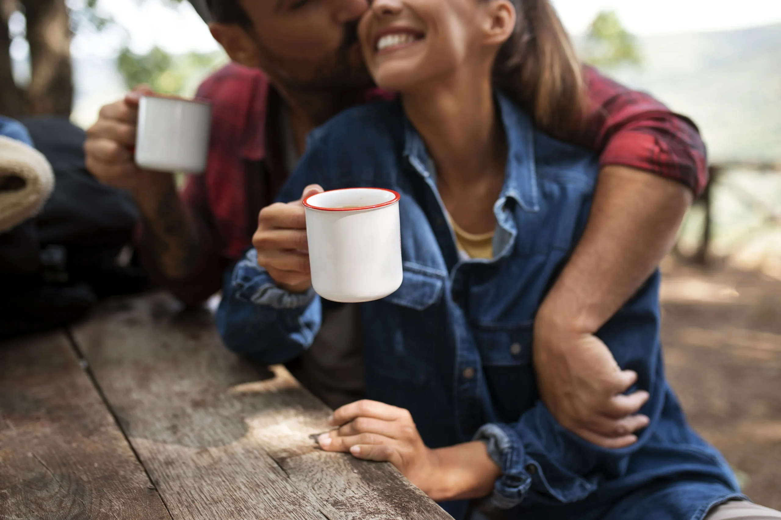 Couple Holding Mugs While Traveling Together In Nature 8 couple holding mugs while traveling together in nature 4