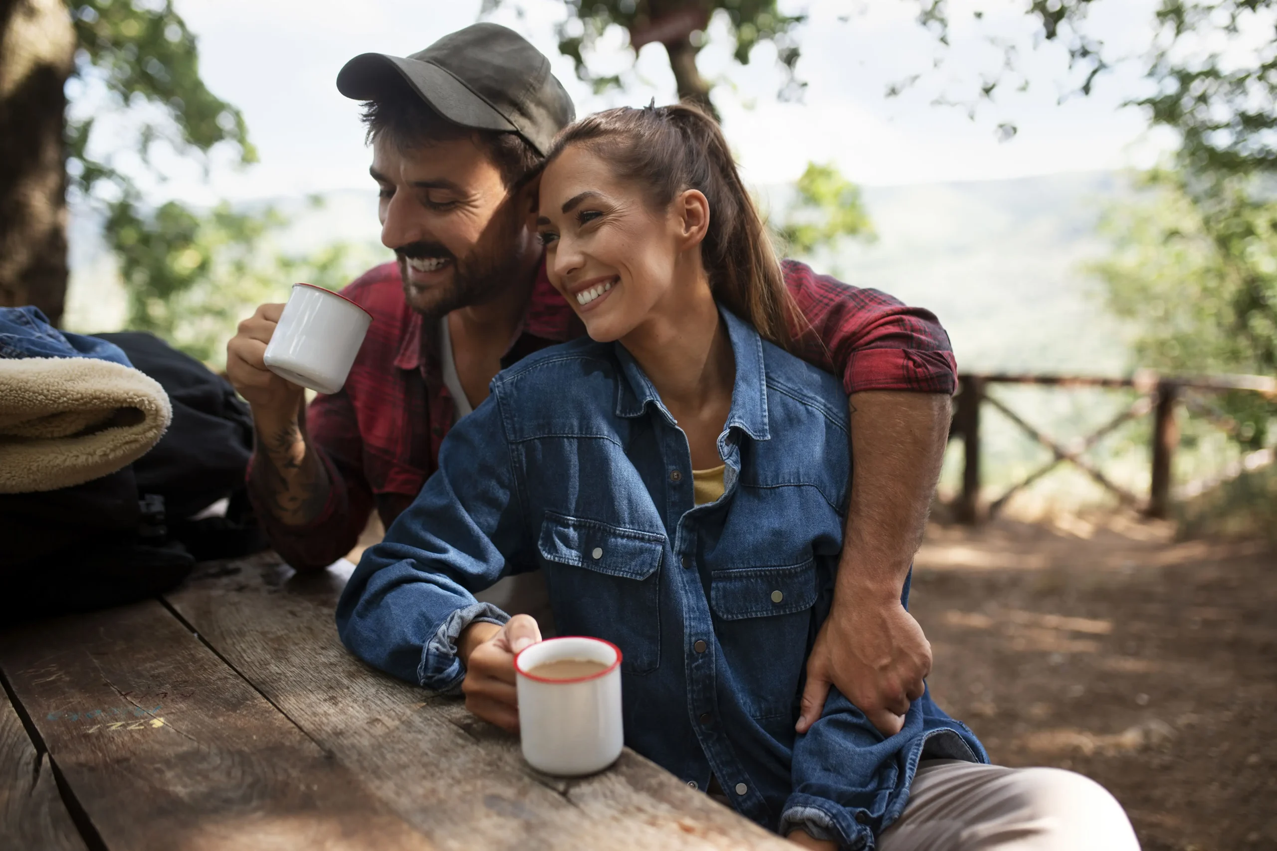 Couple Holding Mugs While Traveling Together In Nature 12 couple holding mugs while traveling together in nature 6