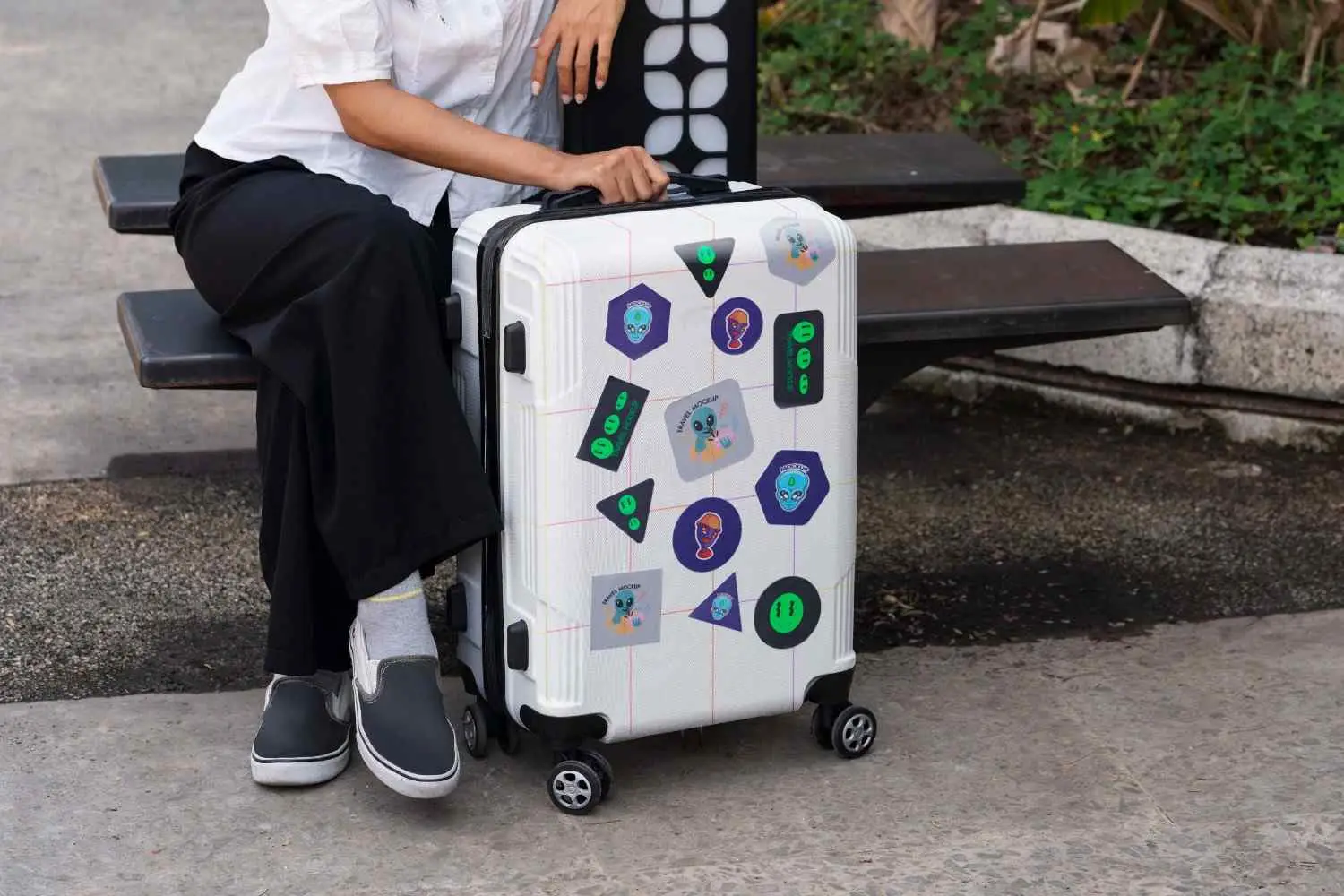 Person Carrying Luggage With Stickers 1