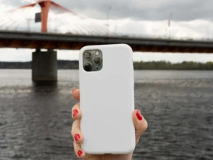 person holding smartphone mock up outdoors 1 2