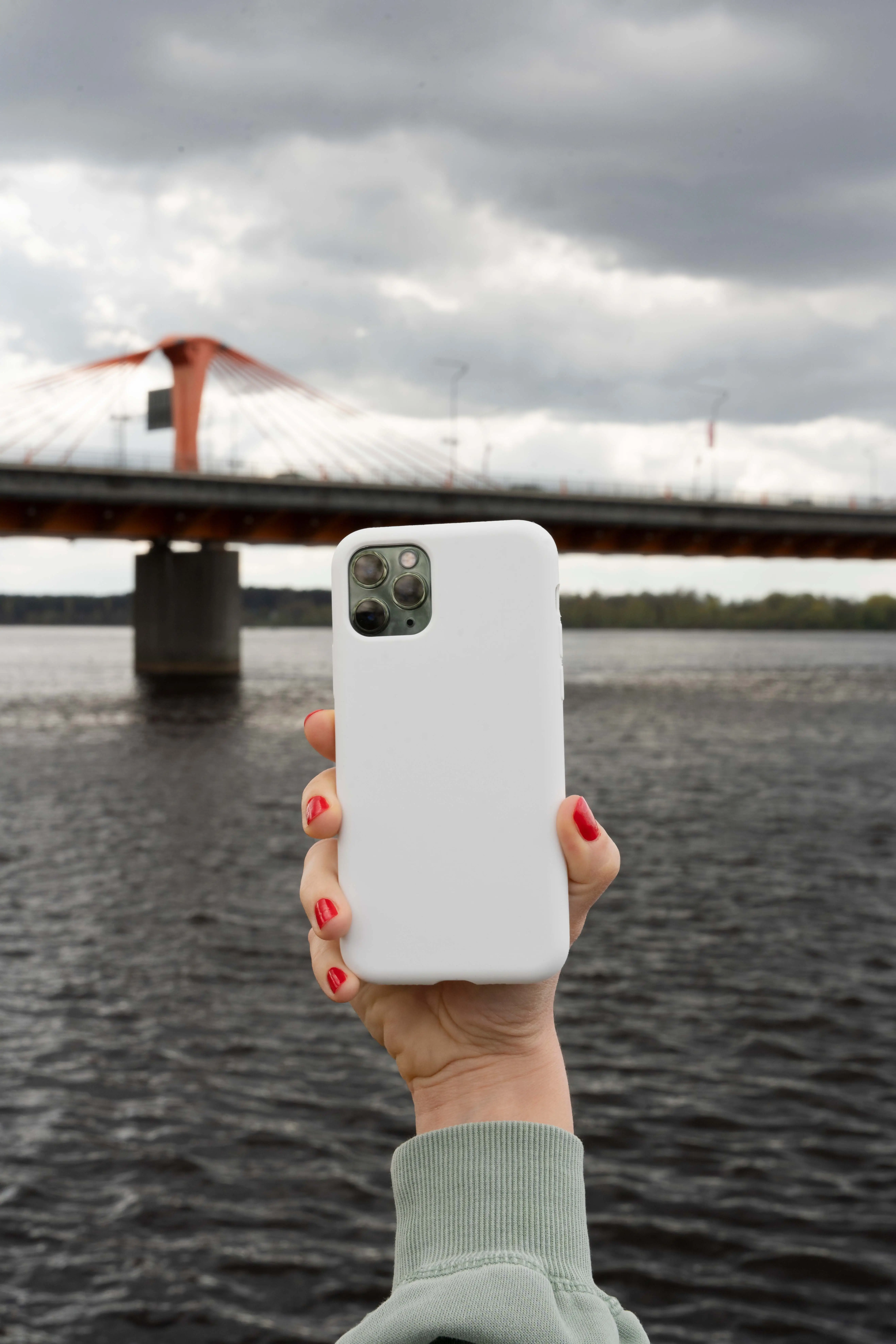 Person Holding Smartphone Mock-Up Outdoors 1