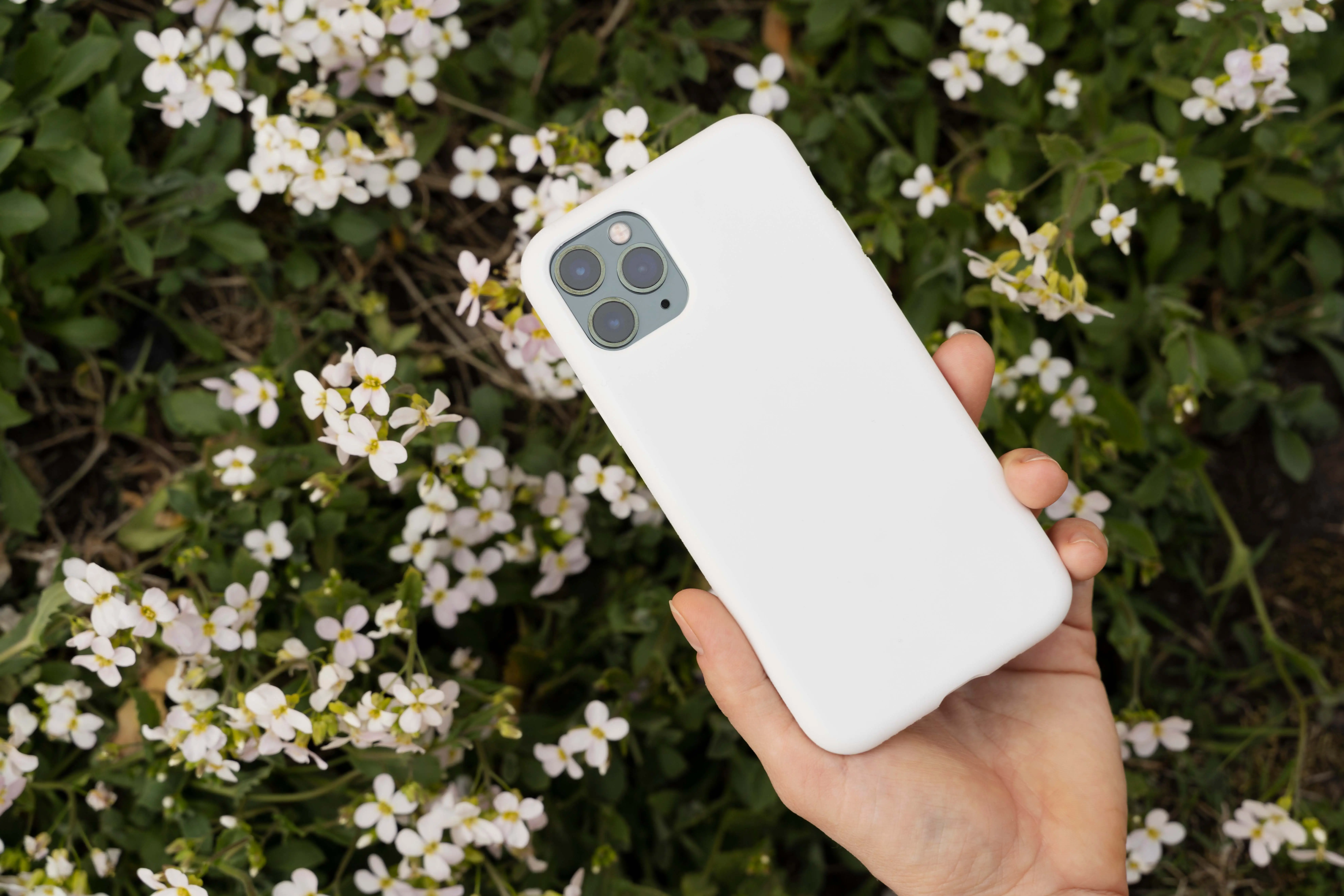 Person Holding Smartphone Mock-Up Outdoors 10