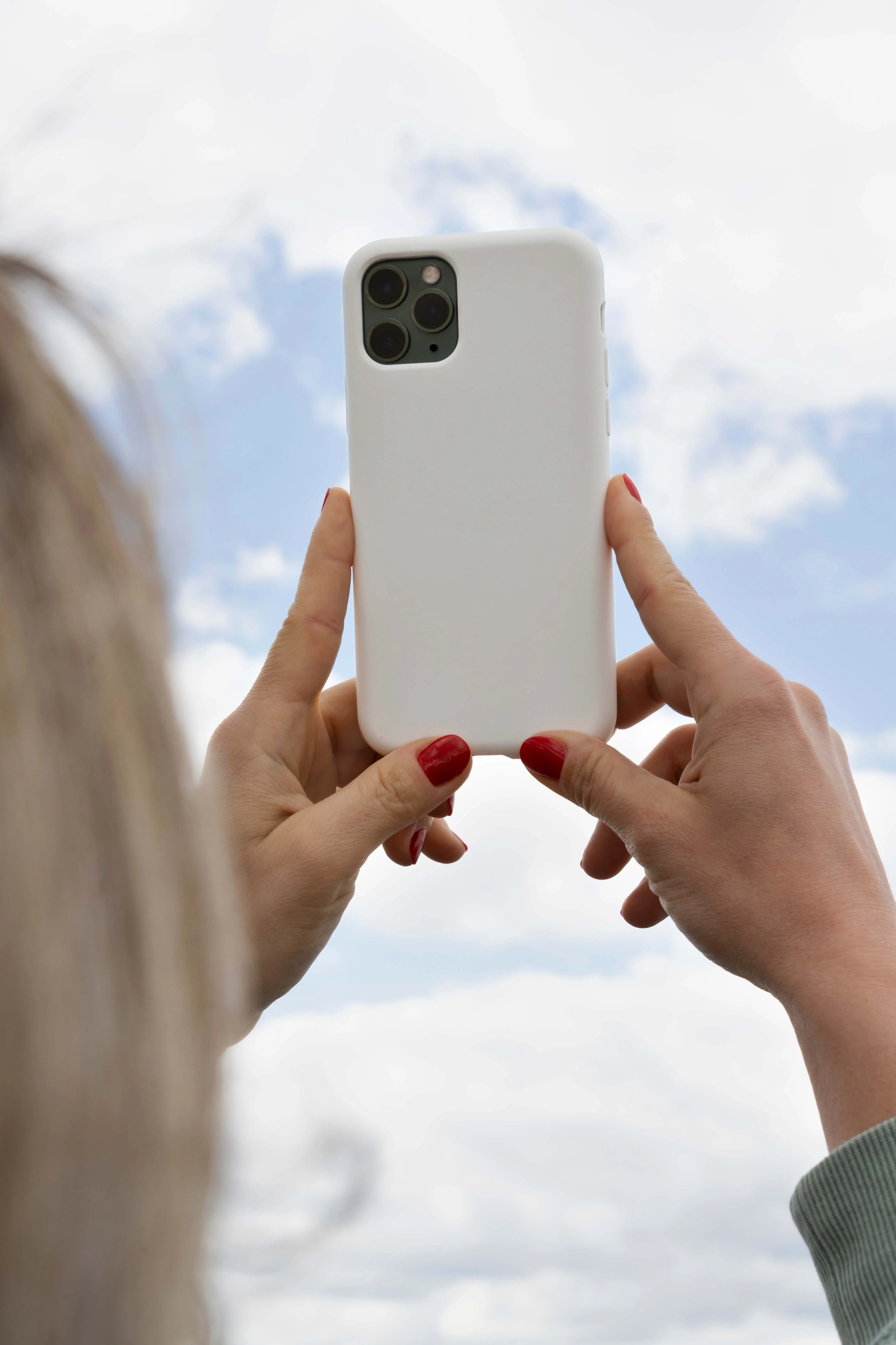 Person Holding Smartphone Mock-Up Outdoors 14