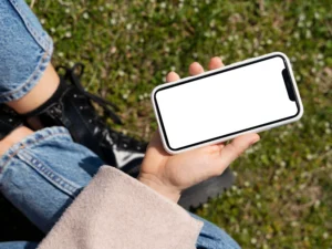 person holding smartphone mock up outdoors 17 2
