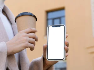 person holding smartphone mock up outdoors 2 2