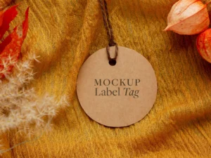 top view of clothing label on orange textile with flowers